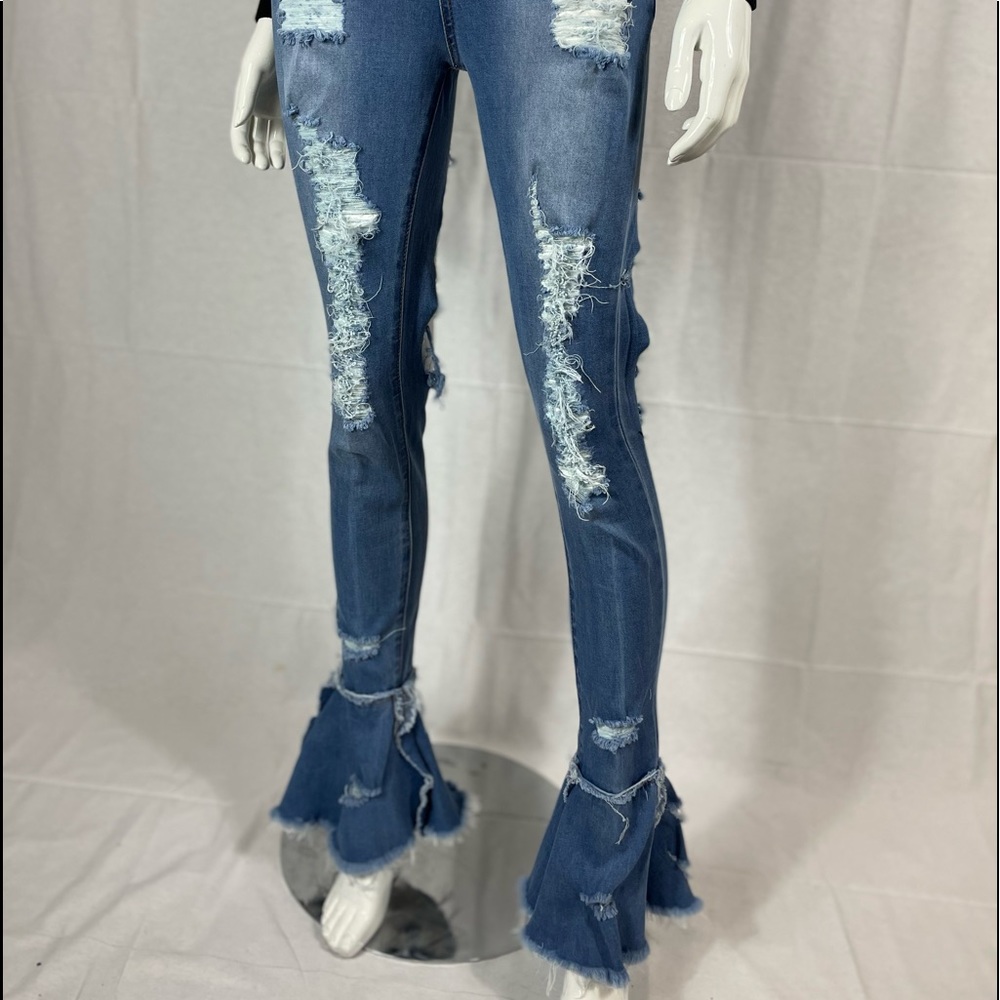 Distressed flare bottom high rise blue jeans